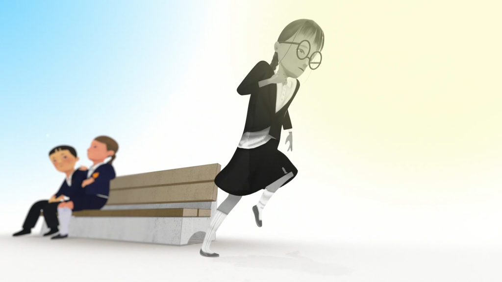 A girl in a primary school uniform is running away from a bench. There are two children sitting on the bench.